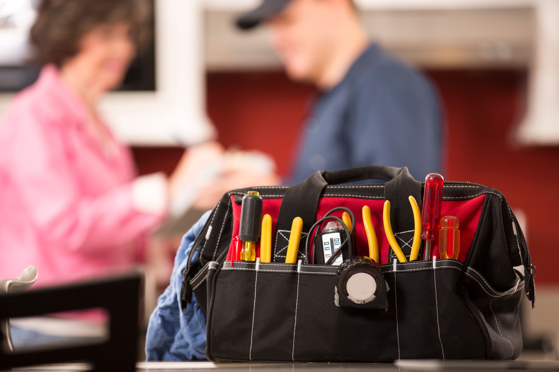 Service Industry: Repairman works at customer's home. Toolbox, tools.